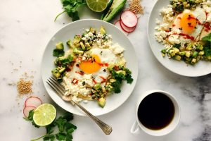 breakfast taco with fried egg on a plate with fresh mustard seed salsa