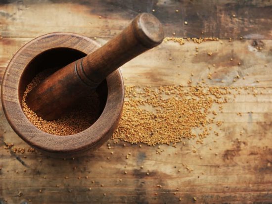 Grinding Mustard Seed with Mortar and Pestle