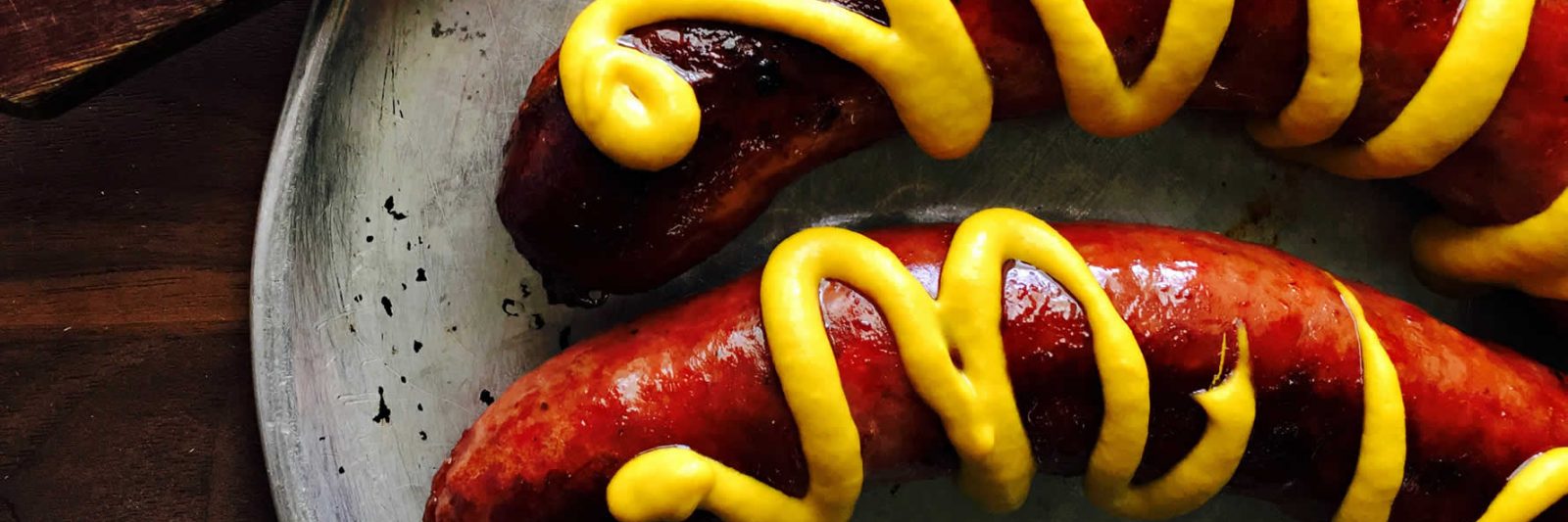 Mustard on sausages