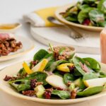 Pear Avocado Salad with Mustard Cranberry Vinaigrette and Candied Pecans